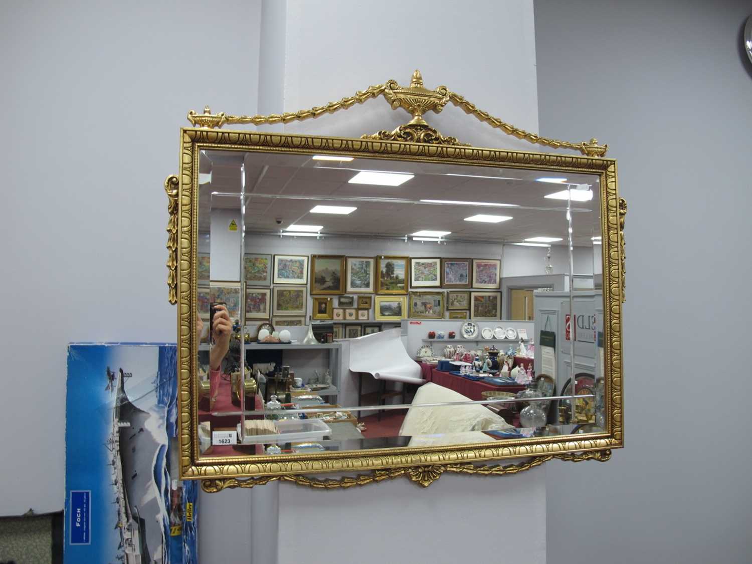 Rectangular Bevelled Wall Mirror, in a gilt frame with swags, vase and scrollwork applied to it,