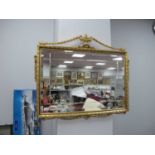 Rectangular Bevelled Wall Mirror, in a gilt frame with swags, vase and scrollwork applied to it,