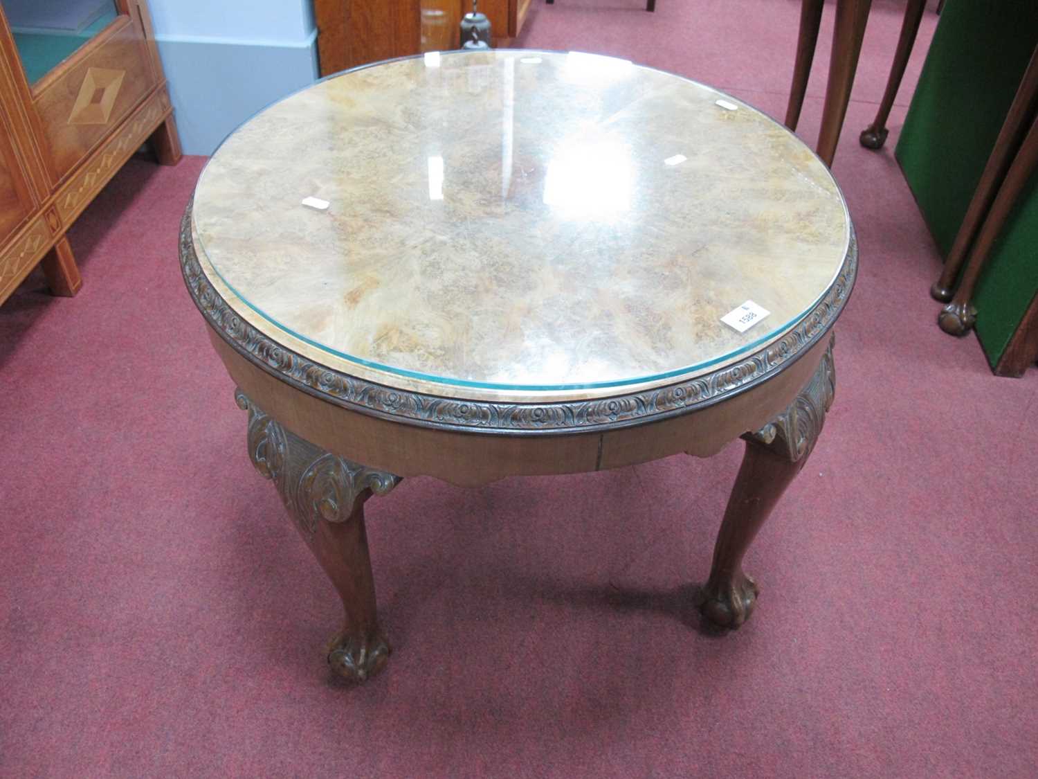 Mid XX Century Walnut Coffee Table of Circular Form, with carved border and knees to cabriole legs