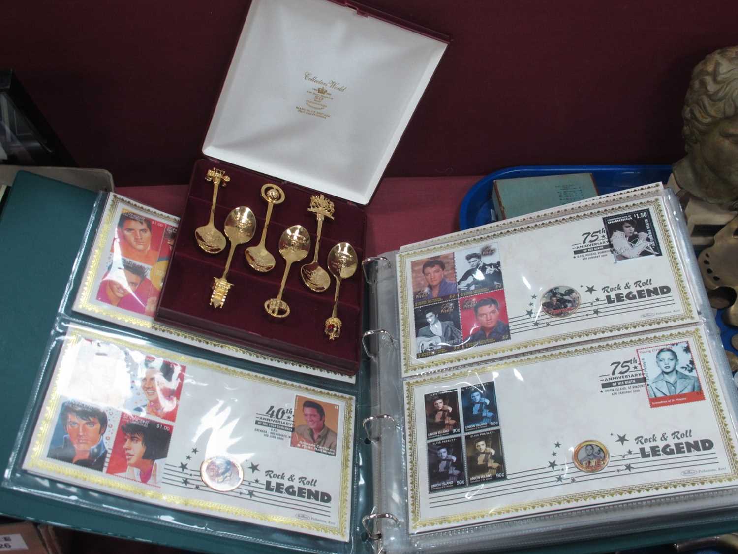 Elvis Presley Commemorative Stamp/Coin 1covers, in an album. six spoons in a case.