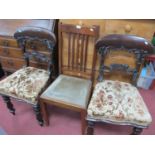 Pair of XIX Century Mahogany Chairs, with a shaped centre rail, upholstered seat, on turned legs,