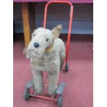 A push along dog made by Lines Bros. (Ireland) Ltd. On a metal frame with Tri-ang wheels.