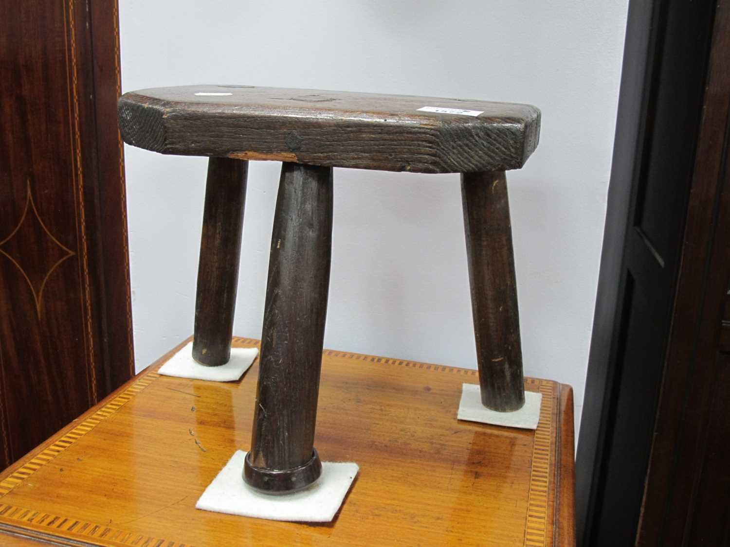 XIX Century Elm Milking Stool, with canted corners to front, 26cm high.