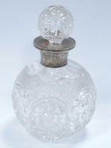 Cut Glass Globular Scent Bottle with Silver Neck, complete with stopper, 17cm high overall.