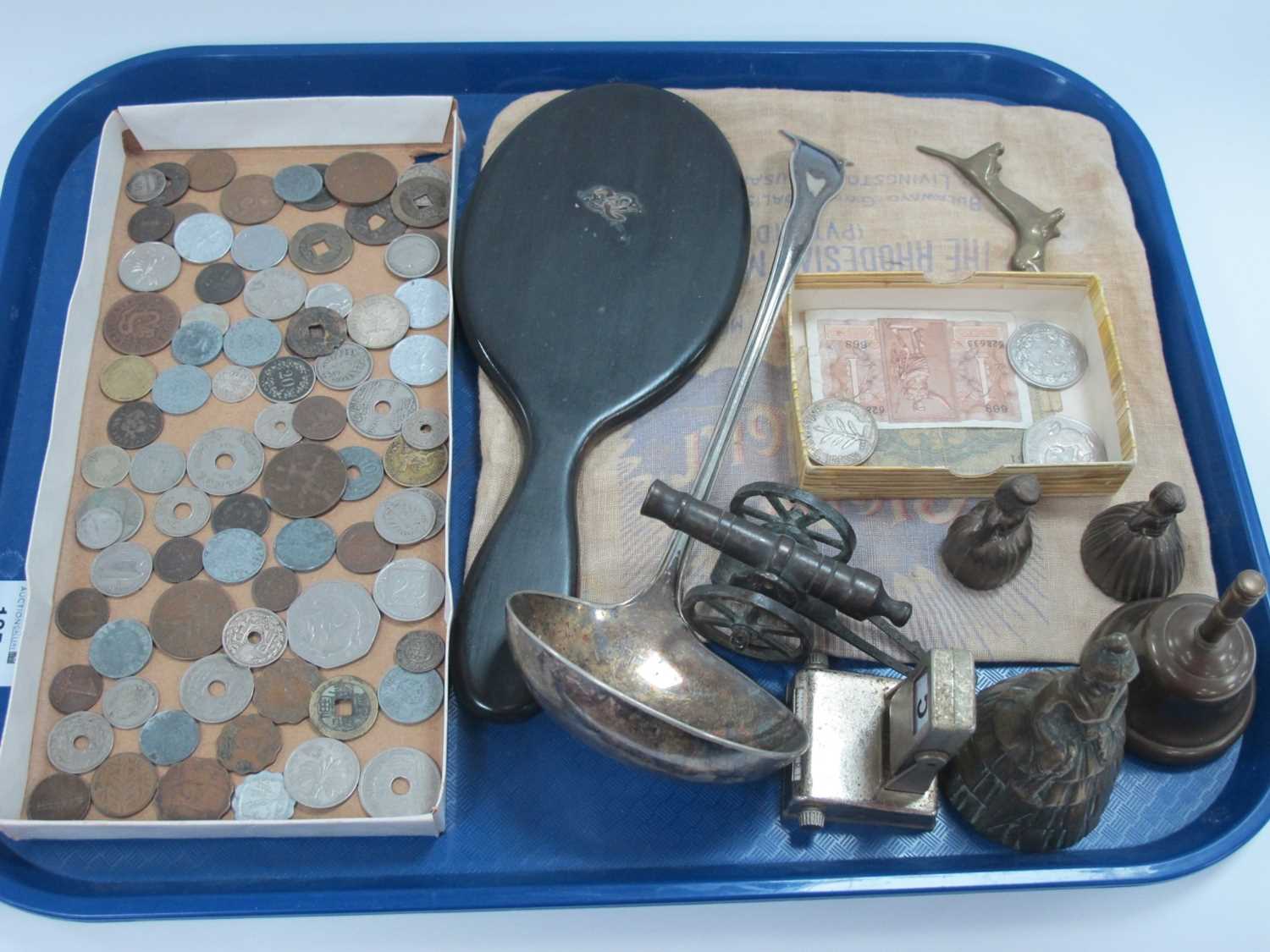 World Coinage, two banknotes, plated ladle, brass bells, cannon, sausage dog, calendar, etc.