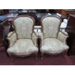 Pair of French Style Walnut Framed Easy Chairs, with scroll and floral carving, carbriole legs,