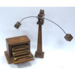 An Unusual Model of a Wooden Bear, counter-balanced on a tall wooden stand and holding a curved