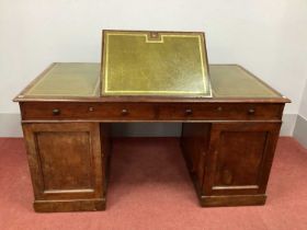 A XIX Century Mahogany Partners Desk, with crossbanded top inset with green leather sciver, hinged