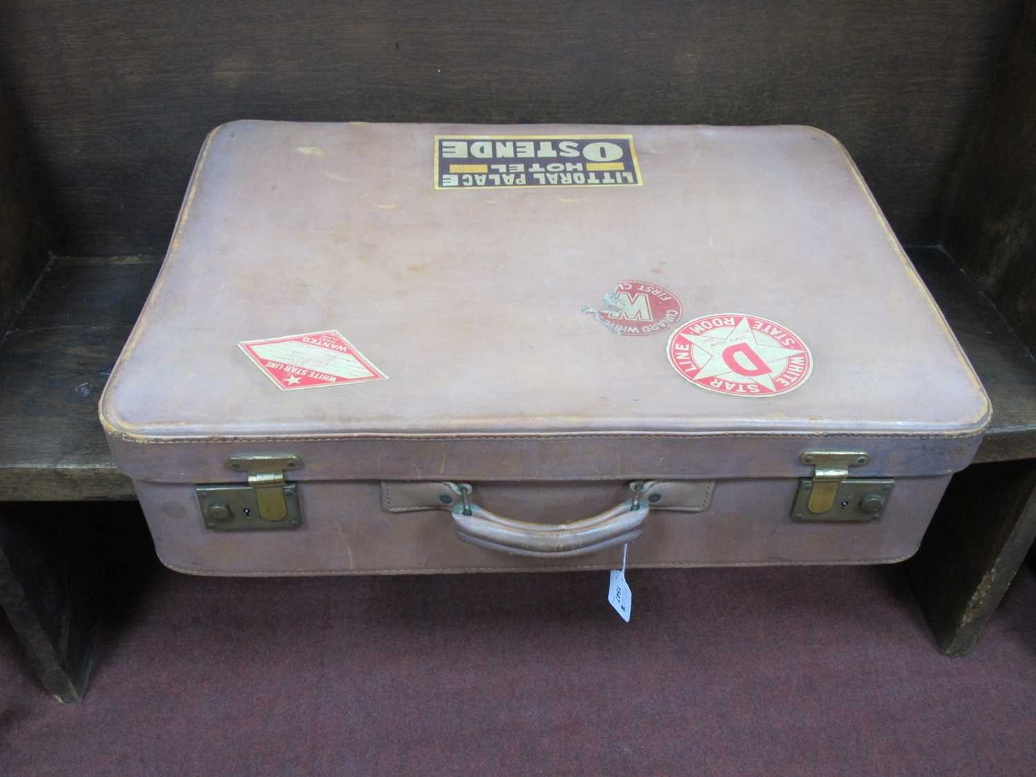 A Large Vintage Leather Suitcase, with some White Star travel labels, etc.