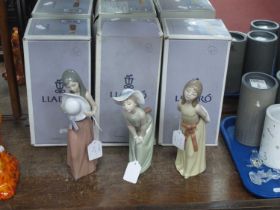 Lladro Pottery Figurines, 5009 (chipped) 5006 and 5007, with boxes 21.5cm high (3).