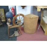 XX Century Spinning Wheel, together with a corner laundry basket. (2)