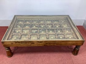 An Indian Coffee Table, circa early XVIII Century or earlier, carved in deep relief with brass