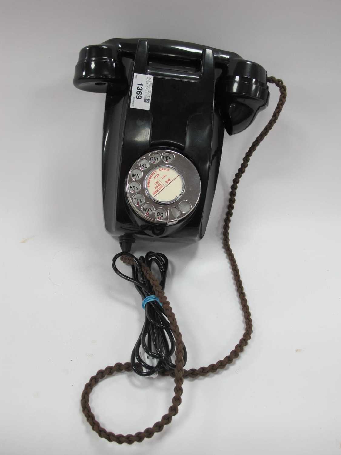 A 1959 Black Bakelite Wall Telephone, with braided cord and new line connection.