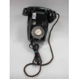 A 1959 Black Bakelite Wall Telephone, with braided cord and new line connection.