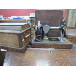 Singer Sewing Machine, in oak case.