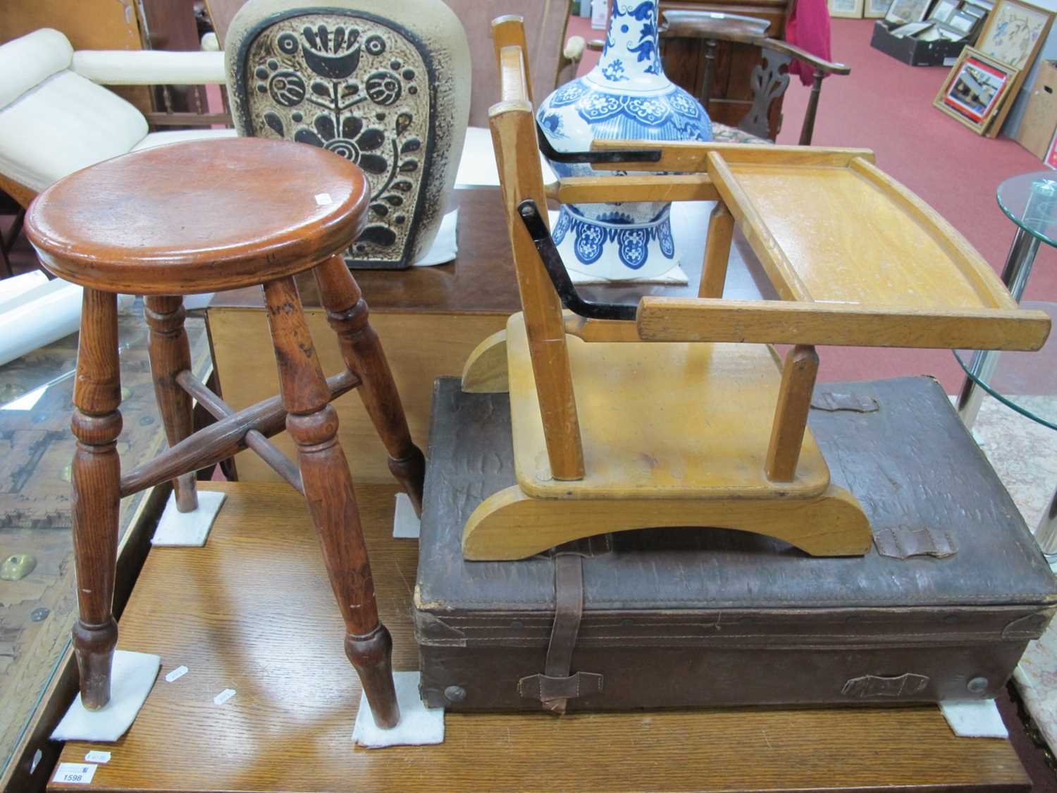 Leather Suitcase, another smaller, baby chair, boston stool.