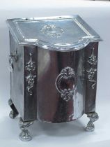 A Decorative Coal Bin, with hinged sloping lid and twin ring handles, on ball and claw feet (