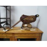 Taxidermy - Pheasant, on wooden naturalistic base, 31cm high, approximately 68cm long.