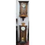 Two XIX Century Walnut Viennese Cased Wall Clocks, each with eight-day movement (2).