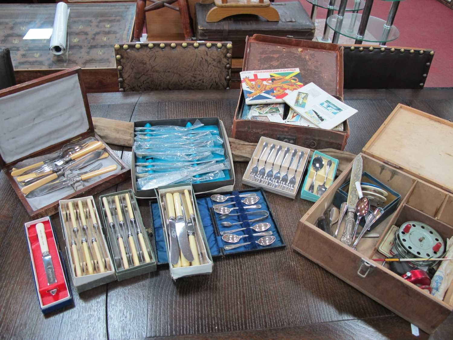 A collection of boxed silver plate cutlery ncluding spoons, knives, forks etc. pocket knife, fishing