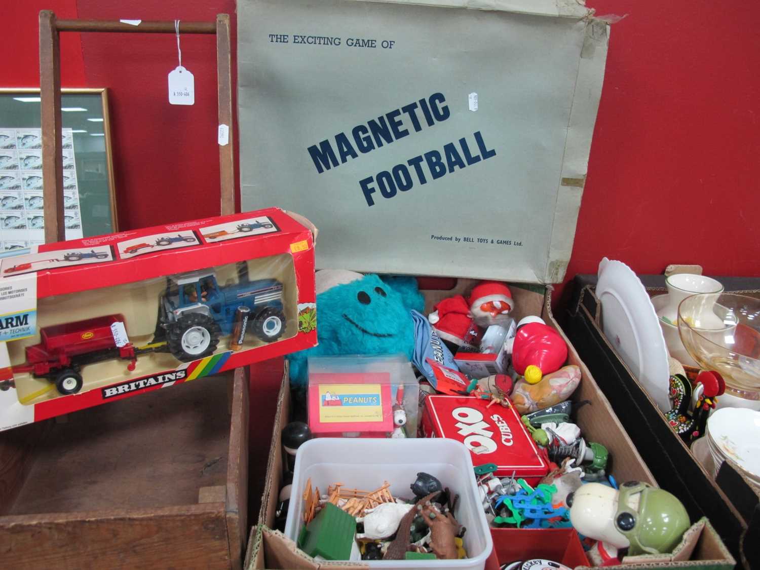 A vintage child's wooden push trolley with Tri-and wheels together with a collection of toys to