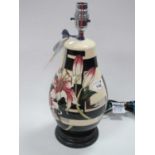 A Moorcroft Pottery 'Stargazer Lily Pattern Lamp Base, L117/9, designed by Vicky Lovatt, 35cm high.