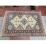 A Persian Style Wool Rug, the centre with lozenge decoration, 145 x 202cm.