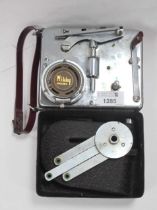 A Japanese 'Mikky Phone' Miniature Portable Folding Gramophone, in a metal case with a carry strap.