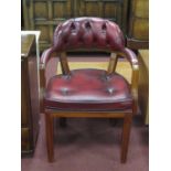 An Oxblood Leather Office Open Armchair, with button low back, top rail and seat. Width of chair