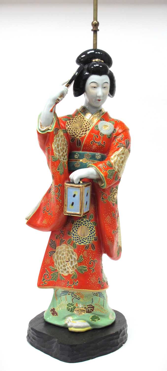 Oriental Pottery Table Lamp as a Geisha Girl, holding a fan in her right hand and lantern in the