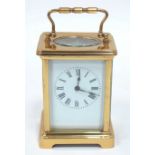 A French Louet Movement Brass Carriage Clock, of typical form with bracket feet, the white front