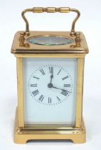 A French Louet Movement Brass Carriage Clock, of typical form with bracket feet, the white front