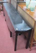 XVIII Century Style Ebonised Wake Table, with drop leaves on square supports, 256cm wide.