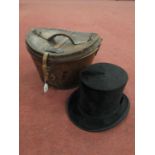 A vintage Christys' London Imperial 'Long Oval' top hat in tan leather top hat case. Dimensions of