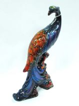 Anita Harris Model of a Peacock, in reactive glazes and lustre enamels, gold signed, 27cm high.