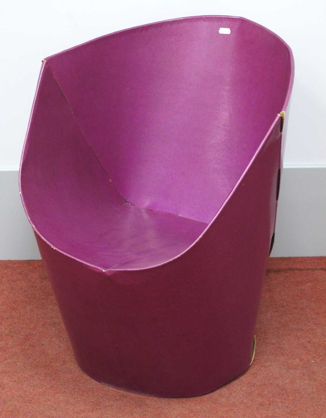 A purple flatpack bucket chair in the style of `Tab` chairs designed by David Bartlett, approx