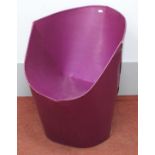 A purple flatpack bucket chair in the style of `Tab` chairs designed by David Bartlett, approx