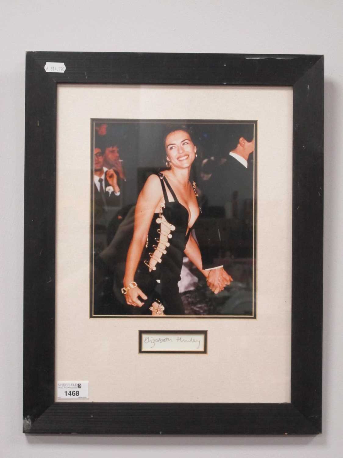 Elizabeth Hurley. Autograph, black pen signed (unverified) on white paper, with image, as a framed