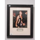 Elizabeth Hurley. Autograph, black pen signed (unverified) on white paper, with image, as a framed