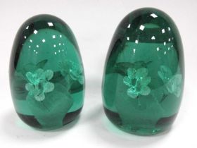 Two XIX Century Green Glass Dumps, of ovoid form each with vase of flowers, inner design the