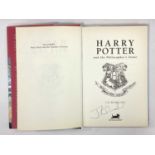 J.K. Rowling Autograph, blue pen signed (unverified) on an edition of The Philosopher's Stone,