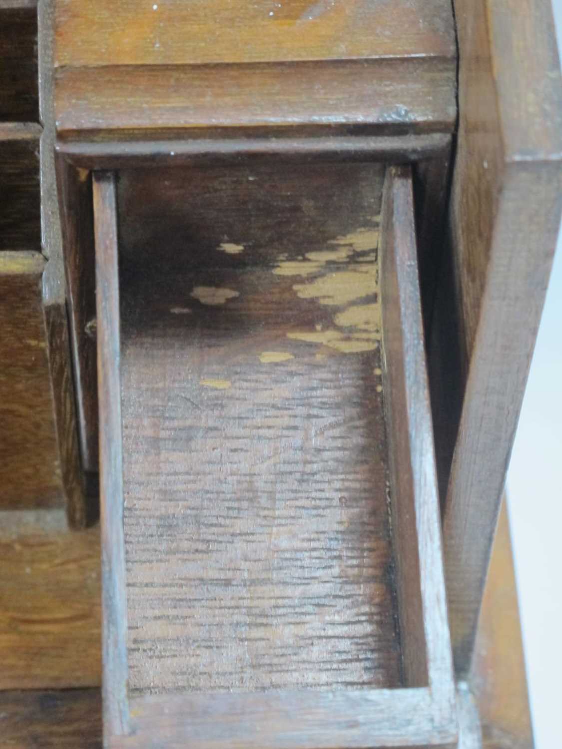 An early XX Century oak stationary and writing box with drop down front, ink well, drawers, calendar - Image 6 of 9
