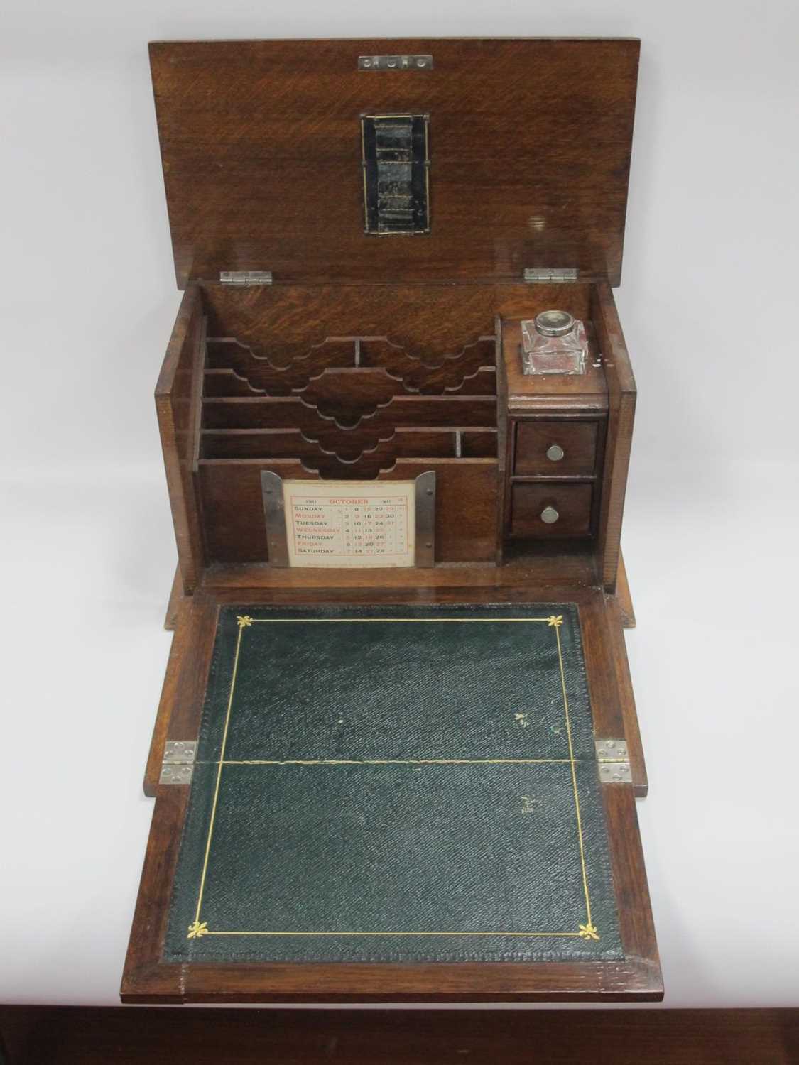 An early XX Century oak stationary and writing box with drop down front, ink well, drawers, calendar - Image 3 of 9