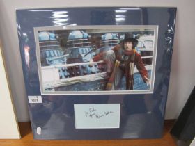 Dr Who. Tom Baker Autograph, black pen signed (unverified) on light blue paper, with image, as an