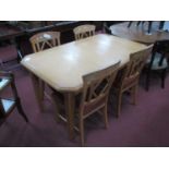 An Extending Oak Dining Table with two inner leaves together with four chairs with diamond shape