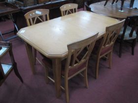 An Extending Oak Dining Table with two inner leaves together with four chairs with diamond shape