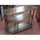 Ercol Tea Trolley, with central shelf, having spindle supports to base, rounded corners, on