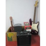 An Encore electric base guitar, Bose companion 3 series II speaker, Dispaly4Top guitar amp,