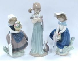 Lladro Figurines, to include Girl Cuddling Cat, 20cm high. (3)