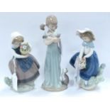 Lladro Figurines, to include Girl Cuddling Cat, 20cm high. (3)